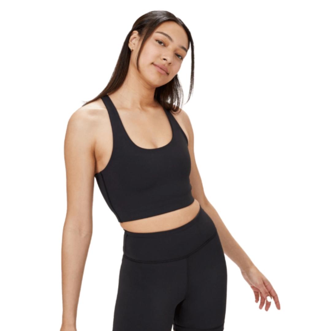 SOUTIEN-GORGE DE SPORT TENTREE INMOTION LONGLINE ACTIVE POUR FEMME COULEUR METEORITE BLACK PORTÉ PAR UNE FEMME VUE DE LA TÊTE AUX VUISSE AVEC LE SOUTIEN GORGE MOULANT