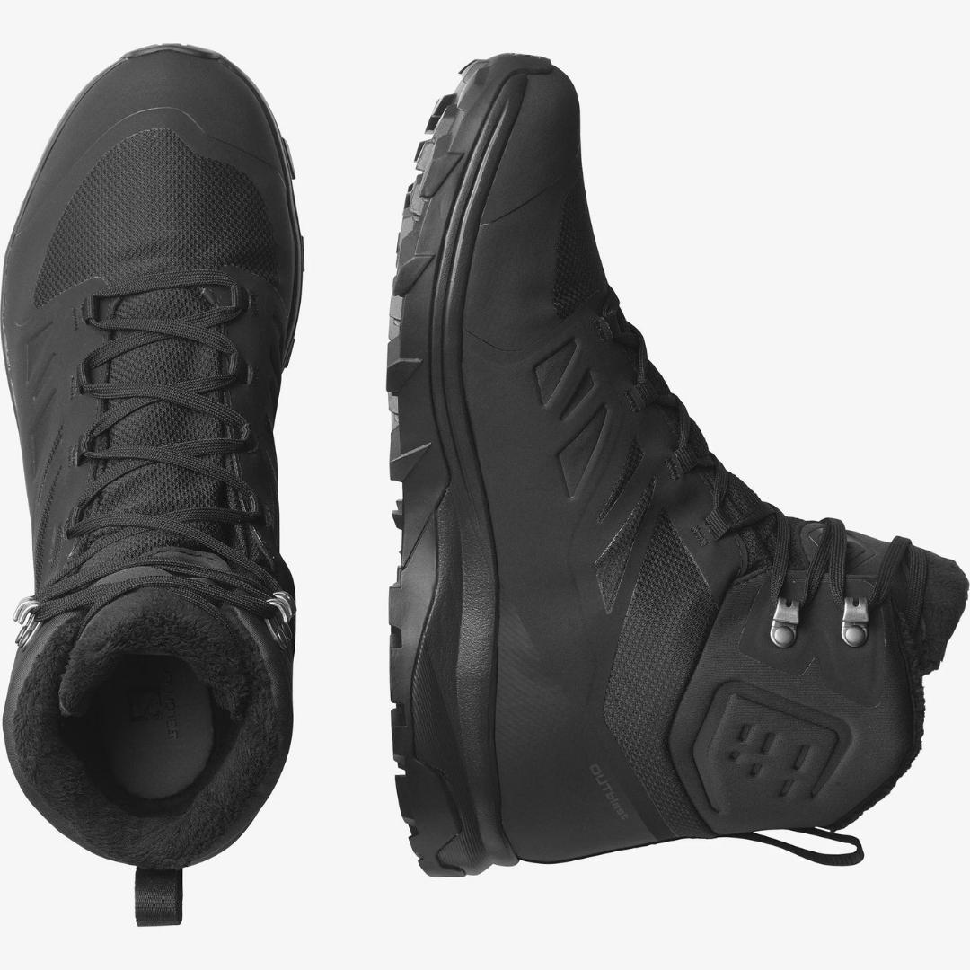 BOTTTE D'HIVER SALOMON OUTBLAST TS CSWP POUR HOMME COULEUR BLACK/BLACK/BLACK VUE DES DEUX BOTTES UNE DE DESSUS ET L'AUTRE DE CÔTÉ