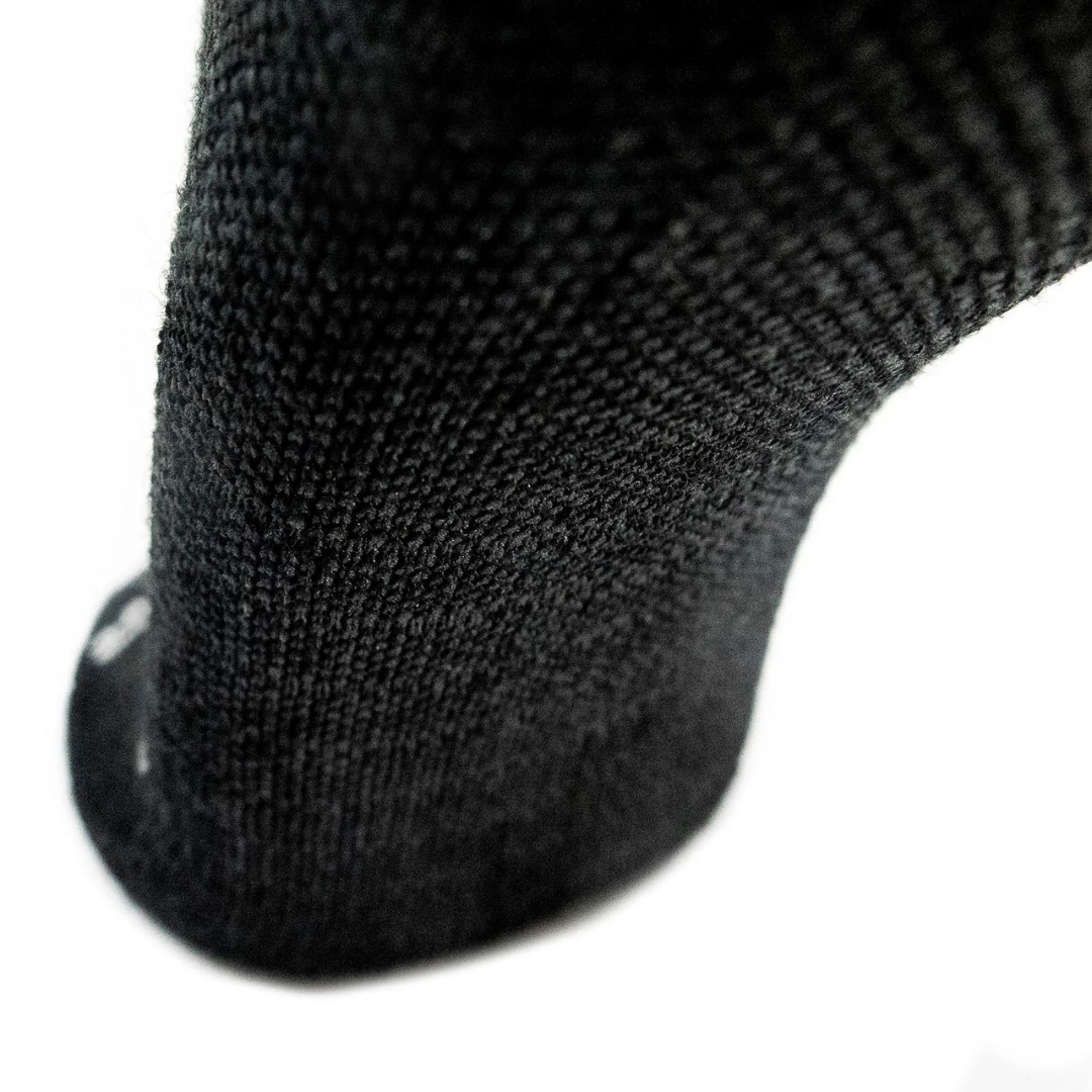 BAS DE COMPRESSION DISSENT IQ FIT HYBRID couleur noir, grsi charcoal, blanc et bleu vue du dessous du pied gris charcoal