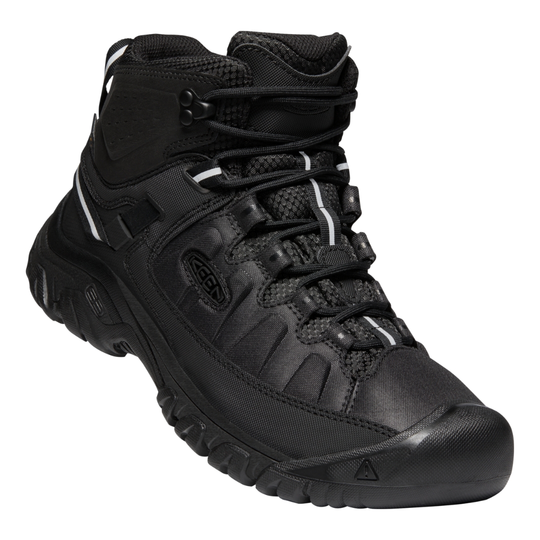 BOTTE DE RANDONNÉE KEEN TARGHEE EXP MID WP POUR HOMME couleur black/black vue de profil avant de la botte droite lacets visible sur la votte noire avec détails réfléchissants