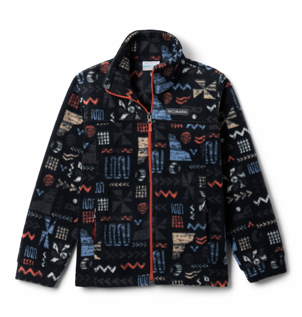 Cette image montre une veste polaire avec un motif géométrique coloré, composé de carrés, de zigzags et de rectangles en rouge, bleu, beige et blanc sur fond noir. La veste a un col montant et une fermeture éclair sur le devant.