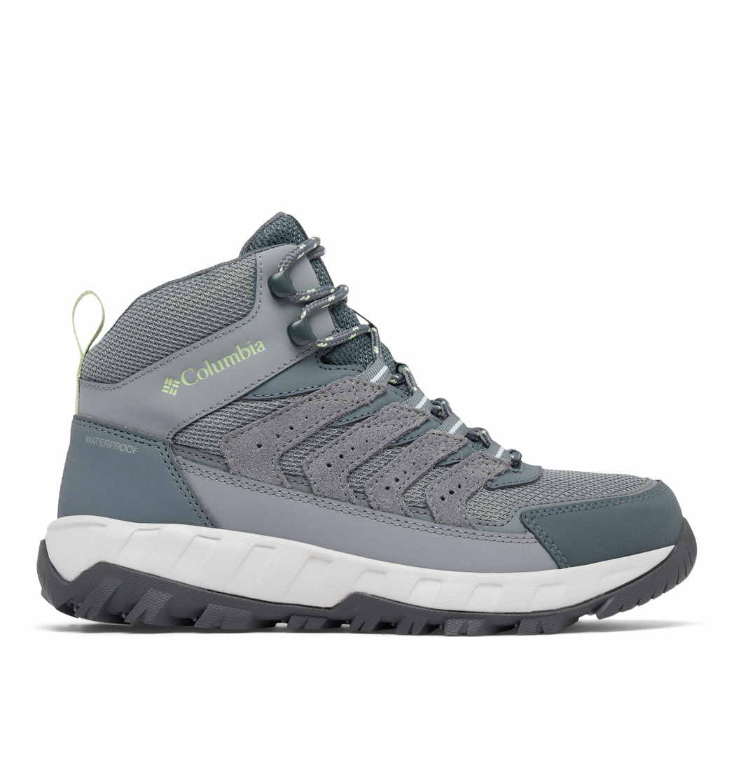 La STRATA TRAIL MID WP WIDE est une chaussure de randonnée Columbia de couleur grise et bleu sarcelle, dotée d'une semelle robuste noire et blanche, d'une tige en mesh et en matière synthétique, d'un laçage à l'avant et d'une languette au talon.