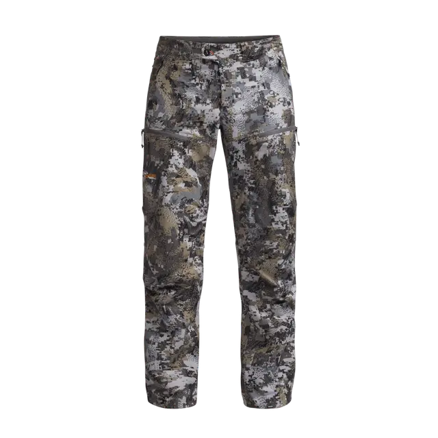 Pantalon ENDURE, orné d'un motif camouflage numérique, doté de poches à fermeture éclair et d'une fermeture à boutons, présenté sur un fond blanc uni.