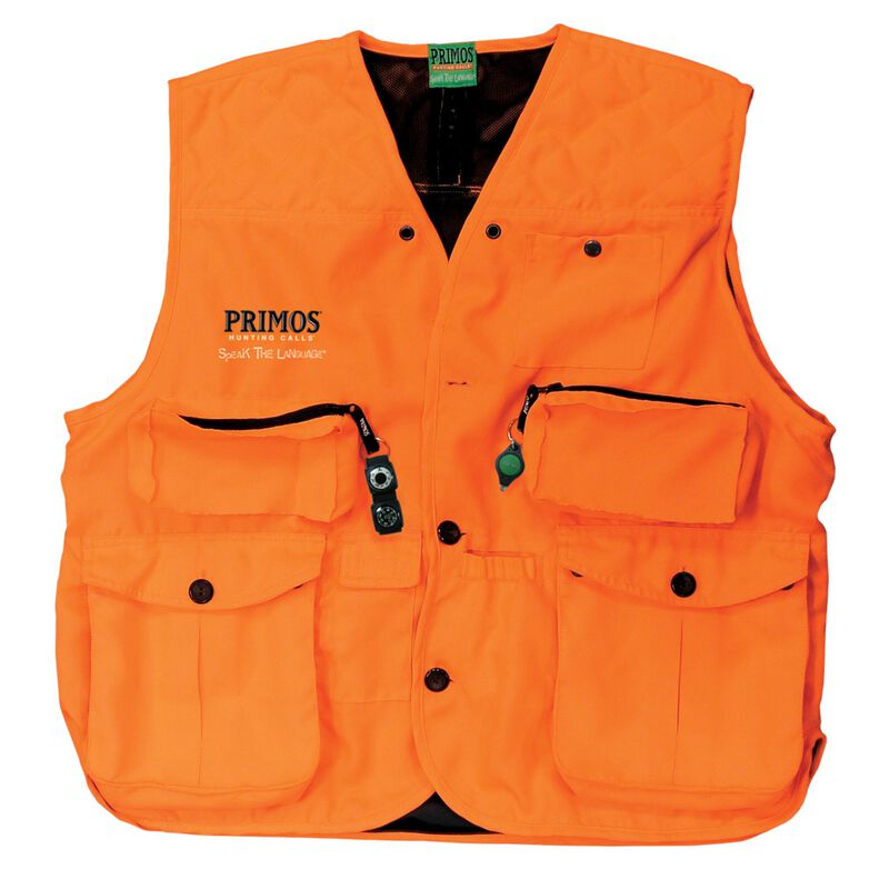 Gilet de chasse orange vif avec plusieurs poches et boutons-pression. La veste porte le logo "PRIMOS" et le slogan "Speak The Language" sur la poitrine, ainsi que des fermetures à glissière noires et des tirettes vertes sur certaines poches.