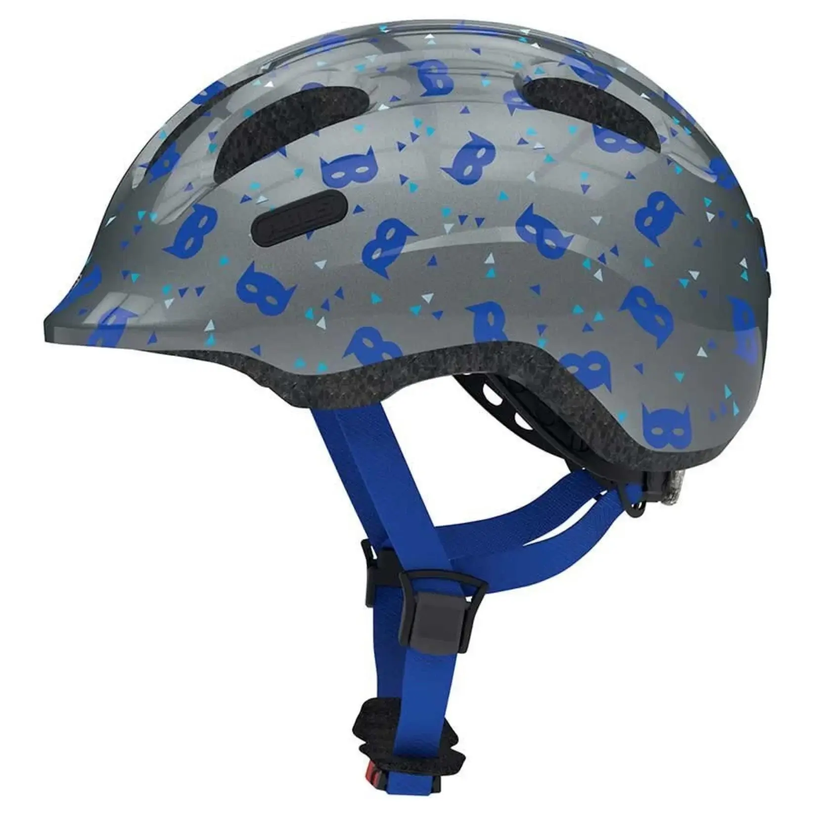 Le casque de vélo pour enfants ABUS Smiley 2.1, de couleur grise, est orné de motifs représentant des masques de super-héros bleus et est doté de sangles bleues, comme on peut le voir sur cette photo prise de profil.