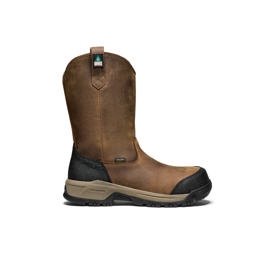 Une seule botte de travail en cuir marron avec un bout et un talon renforcés noirs, une semelle beige et des boucles d'enfilage, présentée de côté sur fond blanc.