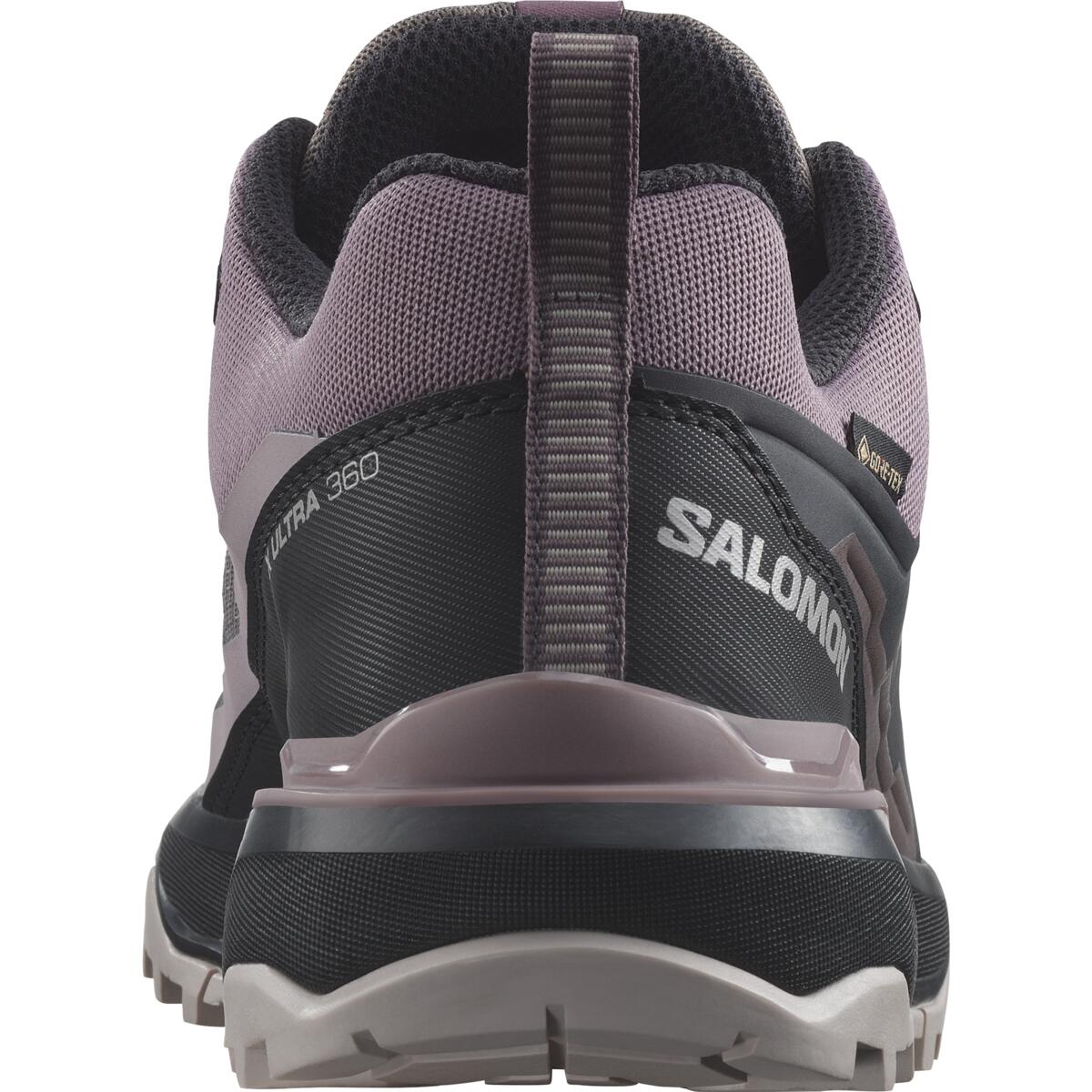 Vue arrière d'une chaussure de trail Salomon, dotée d'une semelle noire robuste, d'une tige en mesh gris foncé et rose, des marques visibles « XT 380 » et « Salomon » et d'une languette de traction au talon.