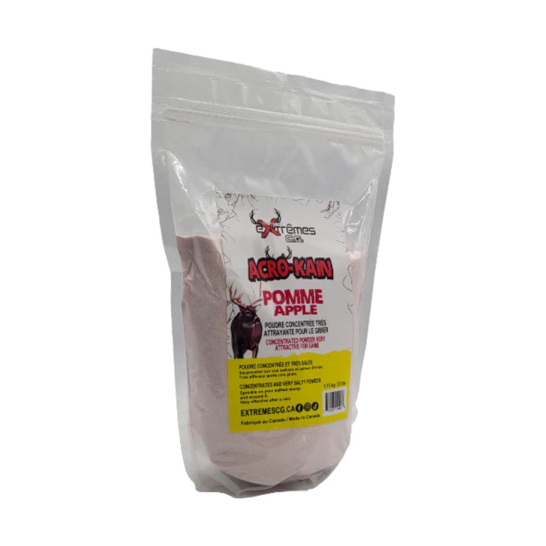 Un sac transparent refermable étiqueté "SALINE EXTRÊMES C.G. ACRO-KAIN 1.15KG POMME" contient de la poudre rose. Avec une illustration de cerf et un texte en français, il s'agit d'un attractif aromatisé à la pomme pour les cerfs.