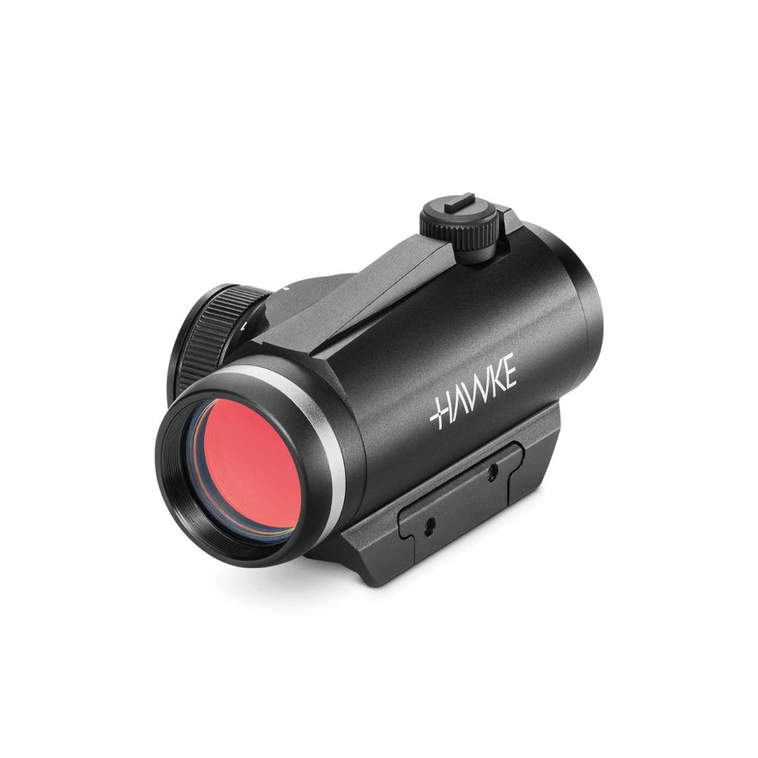 Un viseur point rouge noir de marque Hawke avec une lentille teintée rouge, monté sur une base, présenté sur un fond blanc.