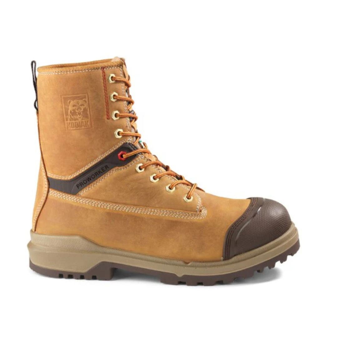 Bottes de travail en cuir beige avec embout en caoutchouc marron, semelle épaisse, œillets métalliques et lacets orange. Le côté est orné du logo et de surpiqûres. Ces bottes paraissent robustes et conçues pour un usage intensif.