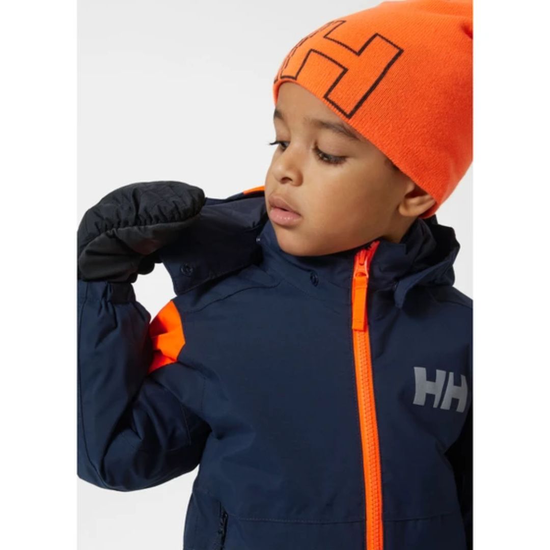 combinaison de neige rider 2.0 bleu et orange sur les épaules portée par jeune homme