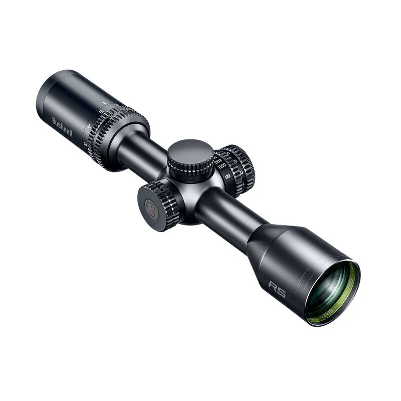 Une lunette de visée noire avec des cadrans de réglage, marqués "Bushnell" et "R5", est représentée sur un fond blanc. La lunette présente un corps cylindrique, une lentille à une extrémité et des boutons de réglage au milieu et à l'arrière.