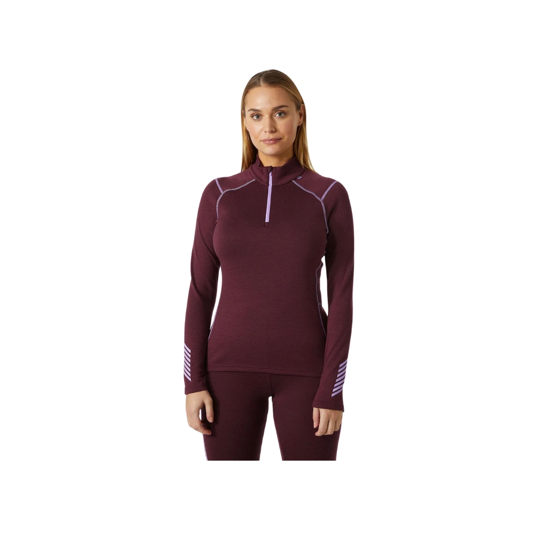 Sous vêtement haut couche de base pour femme demis glissière Helly Hansen couleur Hickory , porté par un femme vue de face sur le haut du corps les bras allongée au corps