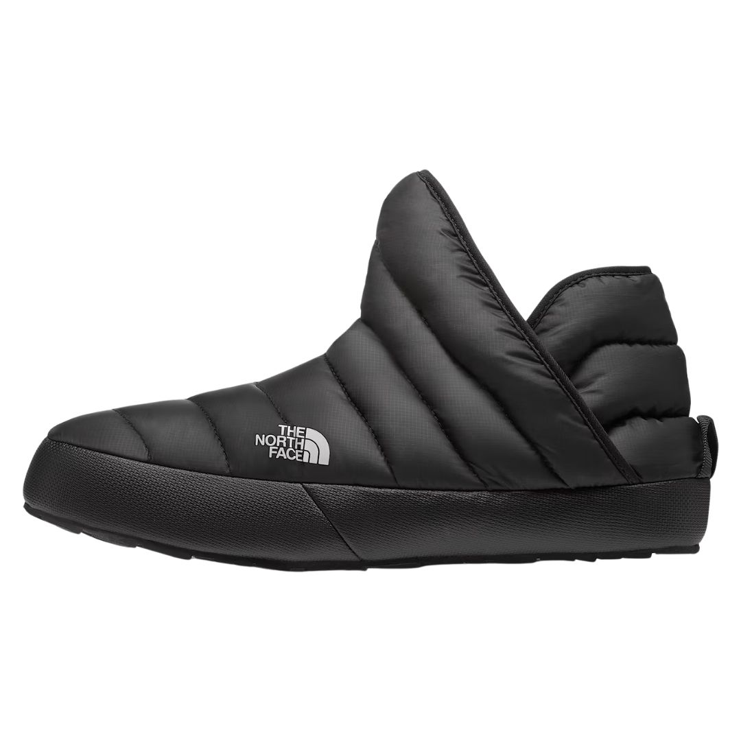 Pantofles matelassées noires isolantes THE NORTH FACE THERMOBALL BOOTIE POUR FEMME : bottines à enfiler dotées d'une semelle en caoutchouc.