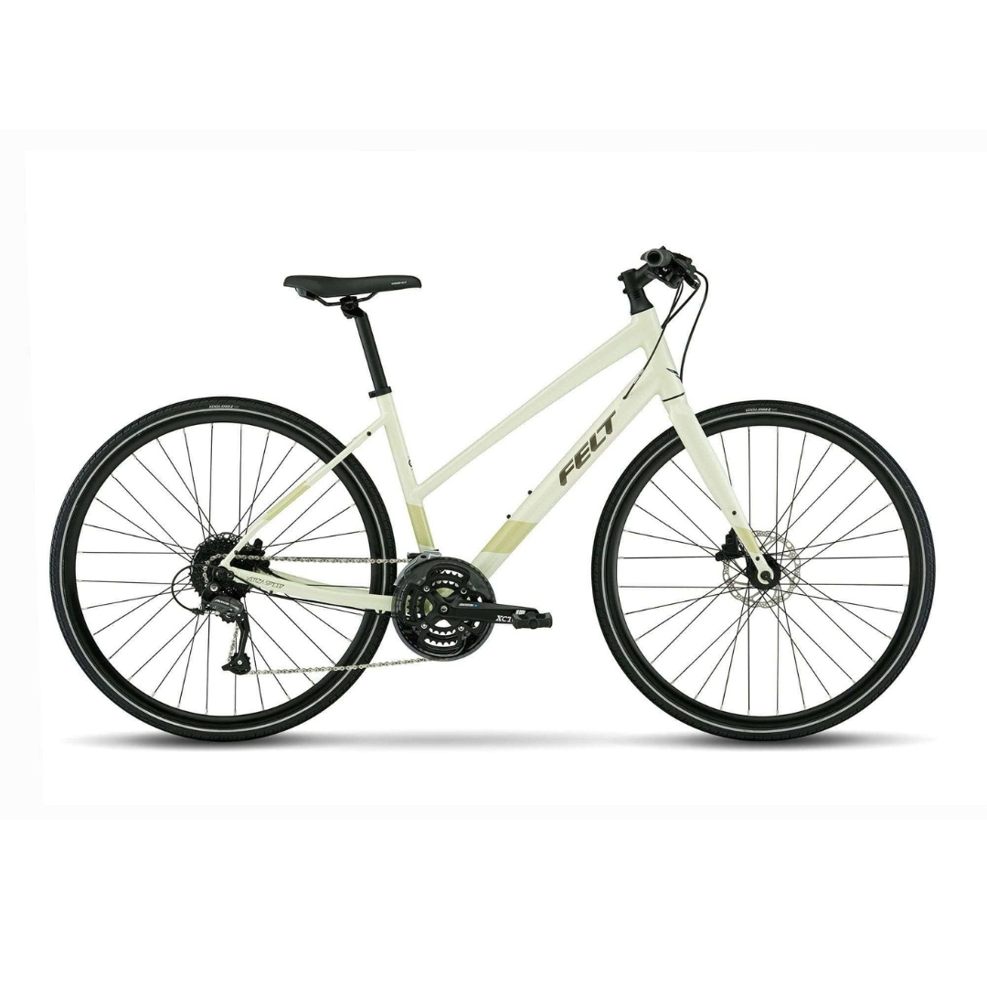 VÉLO HYBRIDE FELT VERZA SPEED 40 POUR FEMME COULEUR GLOW GREEN VU DE PROFIL DU VÉLO BEIGE ET VERT PALE