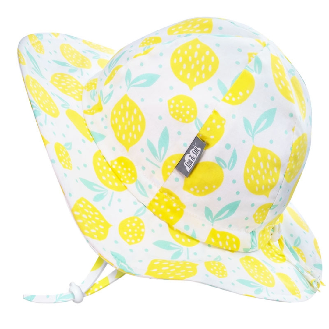 CHAPEAU DE SOLEIL JAN & JUL FLOPPY EN COTON POUR ENFANT COULEUR LEMON FRESH VU DU CHAPEAU BLANC A IMPRIMÉ DE CITRON