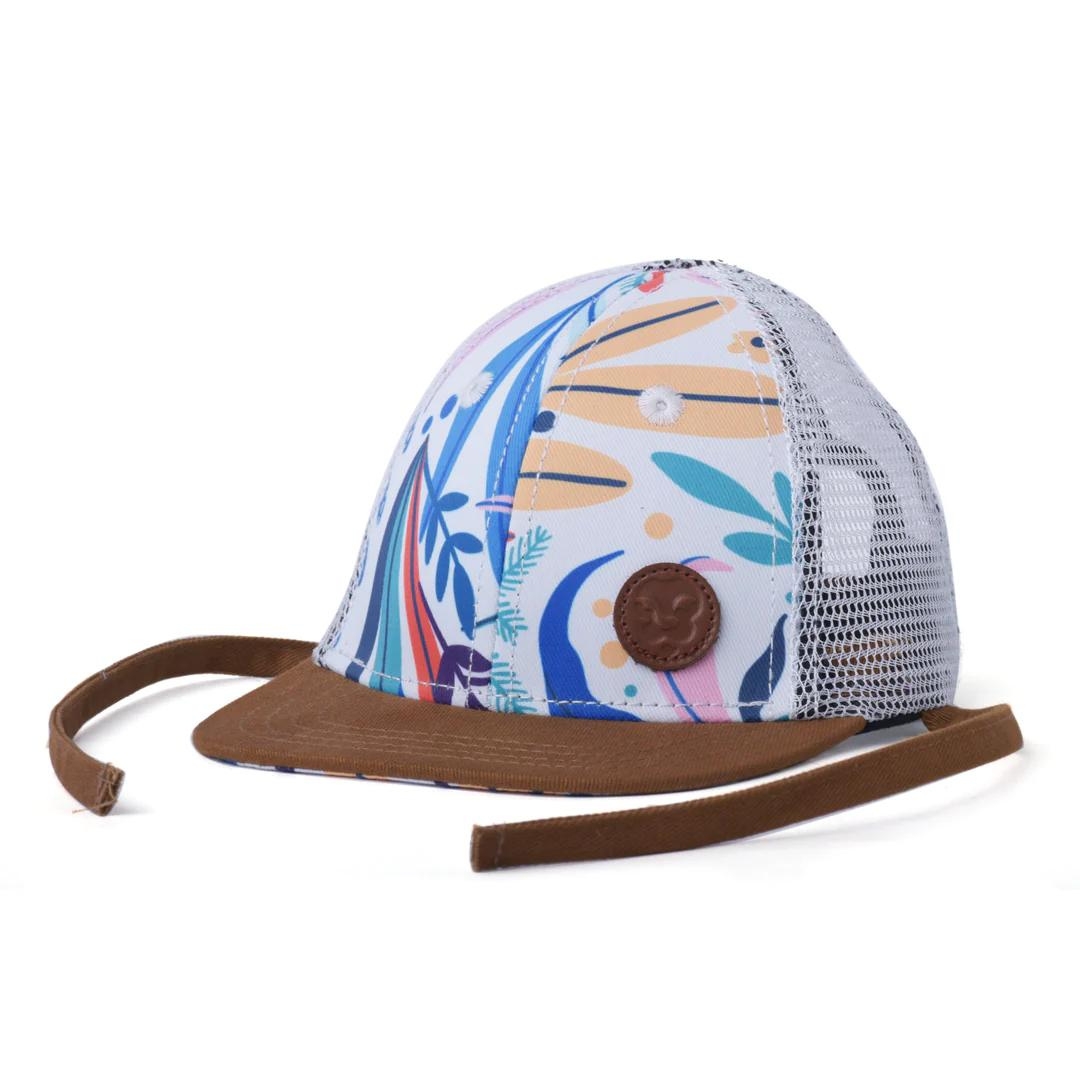 CASQUETTE L & P MORELIA SNAPBACK POUR BÉBÉ ET ENFANT couleur morelia design vue de la casquette blanche imprimé tropicaux et visière brune version pour bébé de profil avant gauche