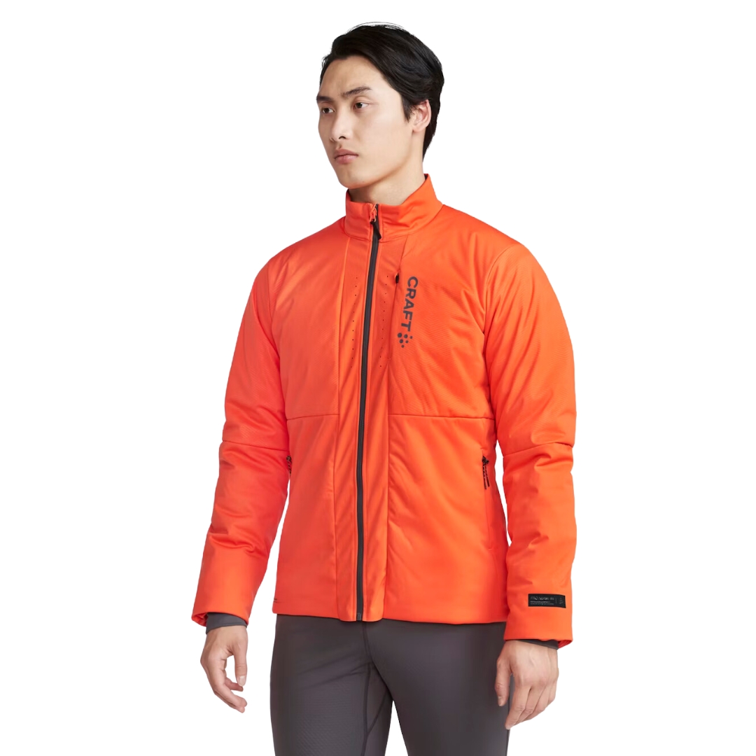 MANTEAU D'ENTRAINEMENT CRAFT PRO NORDIC RACE INSULATE POUR HOMME couleur vibrant/granite vu du manteau orange fluo et gris porté par un homme vu de la tête aux cuisses de face