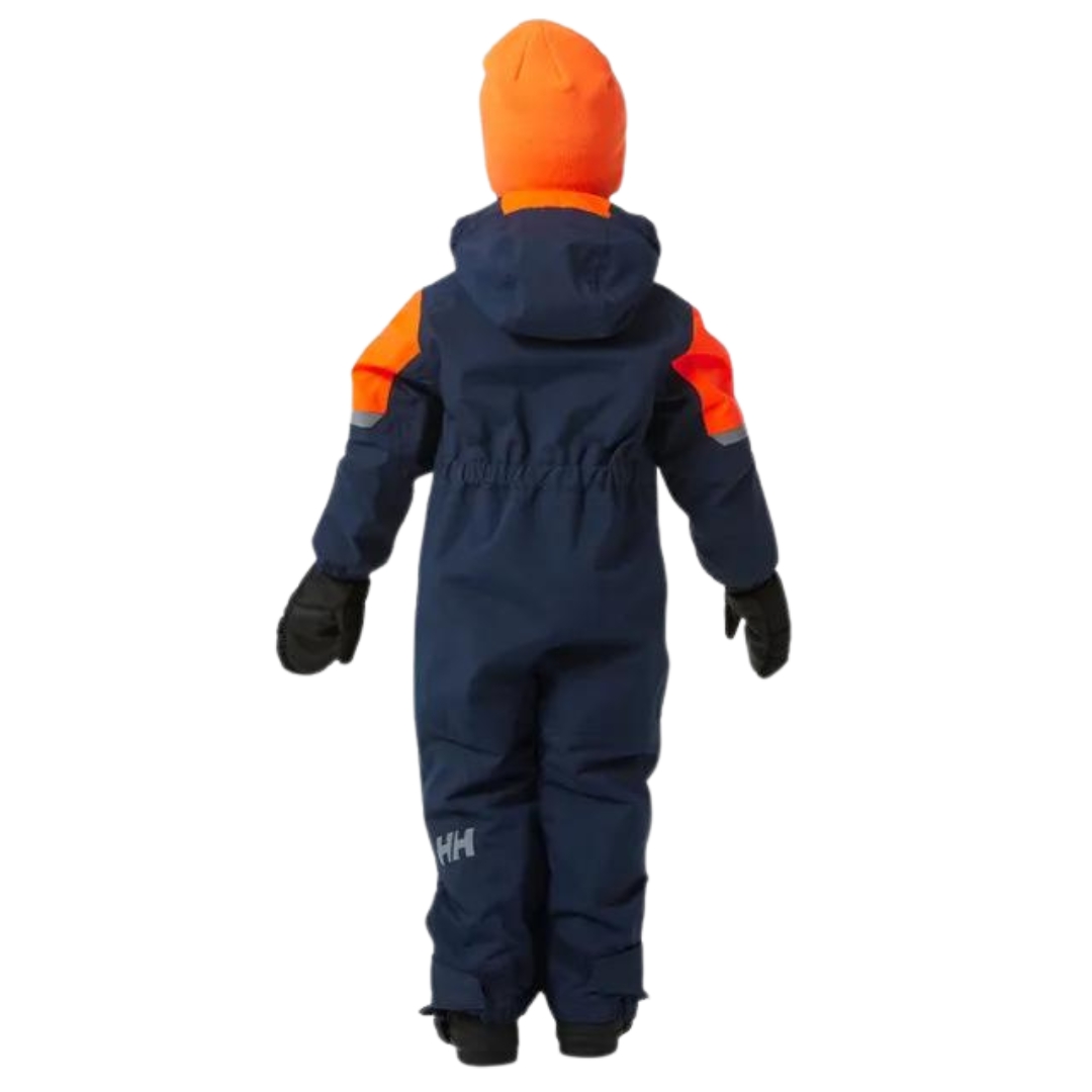 combinaison de neige helly hansen rider 2.0 pour enfant couleur navy vu de l'ensemble bleu marin avec détails orange porté par un garçon vu de dos