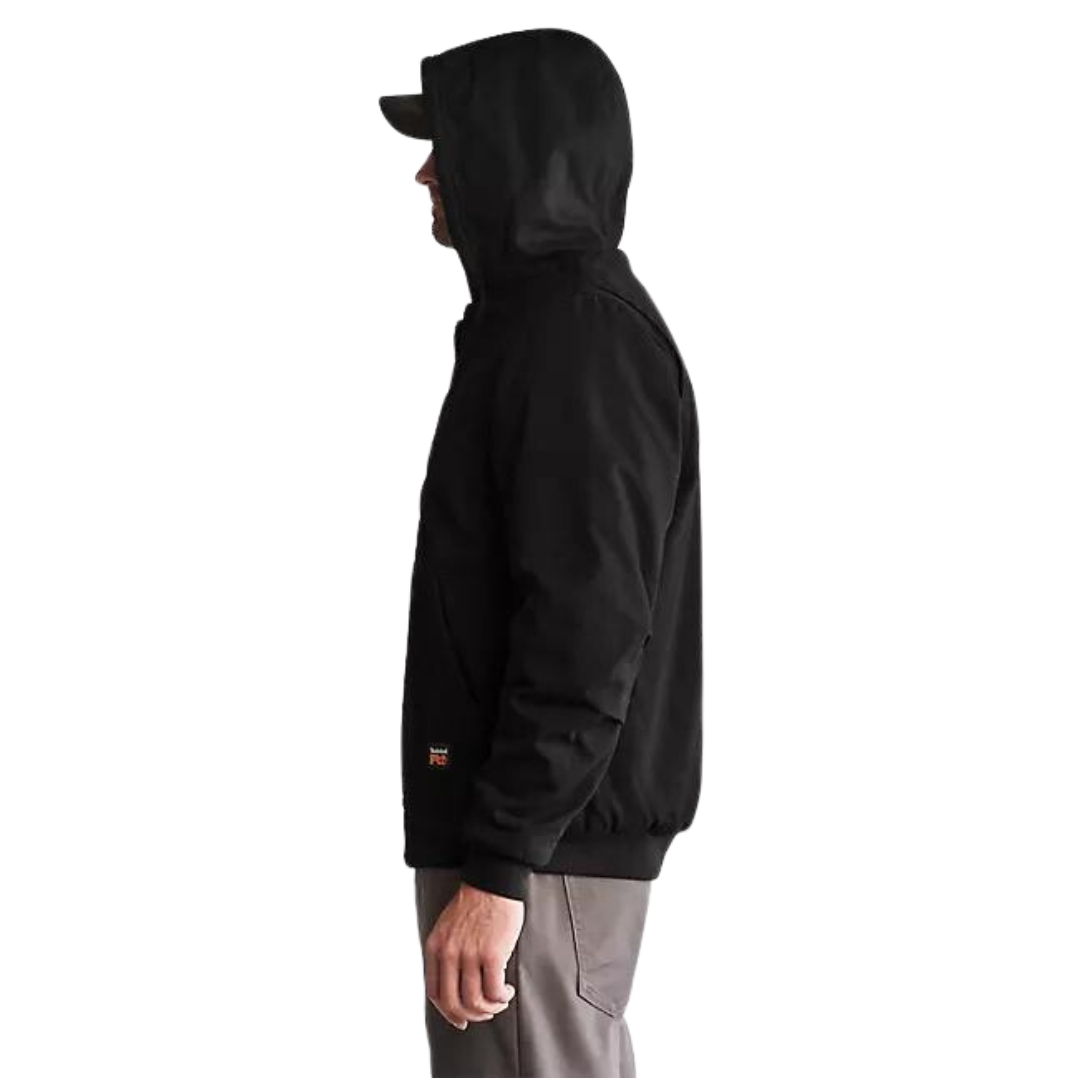 veste en toile à capuchon timberland Pro gritman pour homme couleur black vu de la veste noire portée par un homme vu de la tête aux cuisses de profil gauche