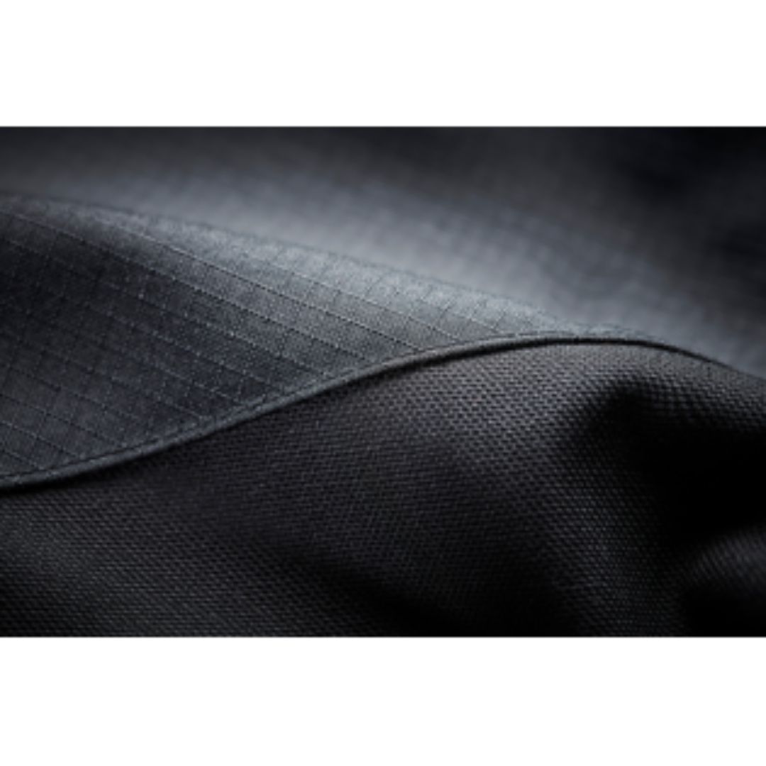 MANTEAU D'HIVER ISOLÉ DE TRAVAIL HELLY HANSEN WORKWEAR OXFORD VUE EN GROS PLAN DE LA TEXTURE DU TISSU PRINCIPAL DU MANTEAU