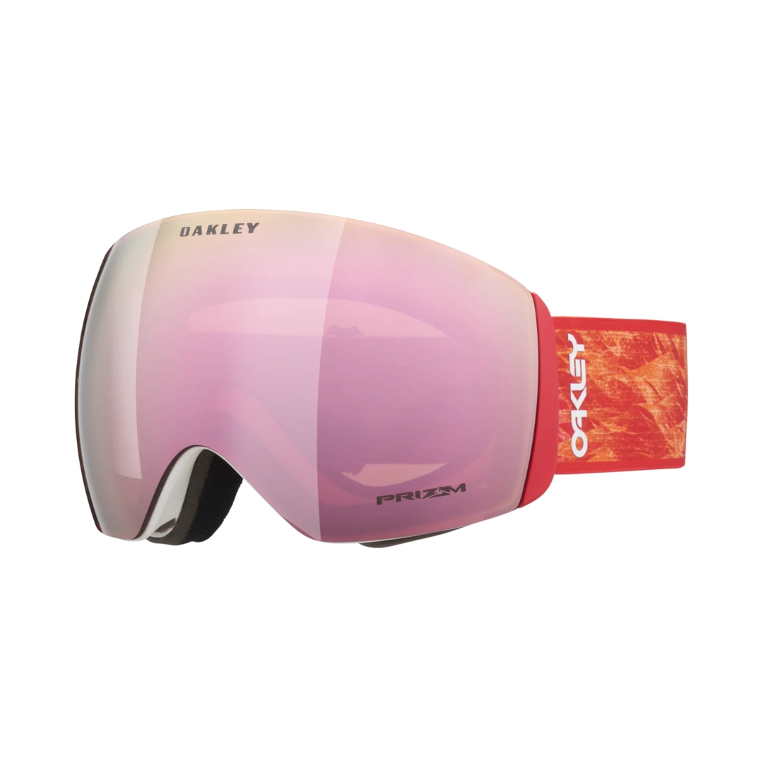 LUNETTE DE SKI ALPIN OAKLEY FLIGHT DECK L POUR ADULTE COULEUR RED BLAZE / PRIZM ROSE GOLD IRIDIUM VUE DE LA LUNETTE AVEC BANDE ÉLASTIQUE ROUGE À MOTIFS ABSTRAITS JAUNE ET LENTILLE ROSE DORÉE MIROIR DE PROFIL AVANT GAUCHE