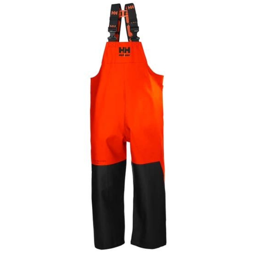 SALOPETTE DE TRAVAIL IMPERMÉABLE HELLY HANSEN WORKWEAR STORM  couleur dark orange/black vue de face logo helly hansen au centre avant renfort aux devant des jambe noir sur la salopette orange avec bretelle à logo hh