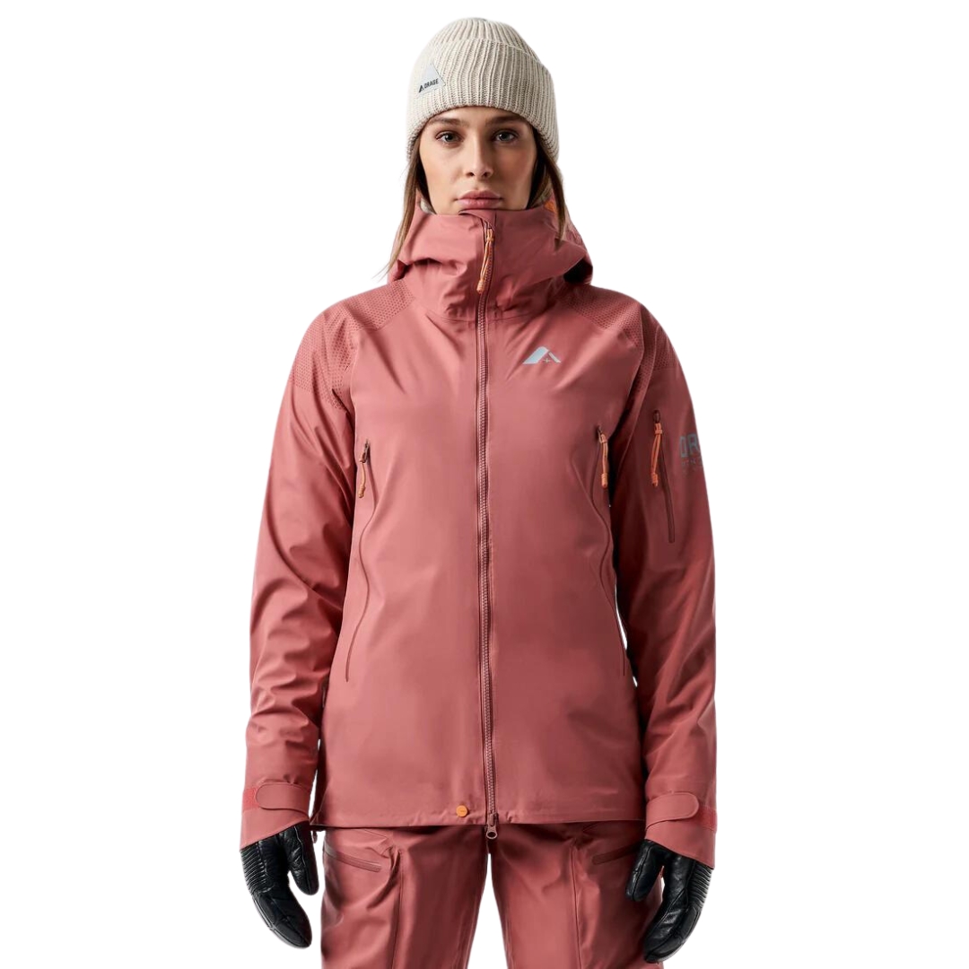 COQUILLE LÉGÈRE DE SKI ALPIN ORAGE MTN-X ALPINA POUR FEMME couleur K111-CEDAR vu du manteau rose/orangé porté par une femme vue de la tête aux cuisses de face