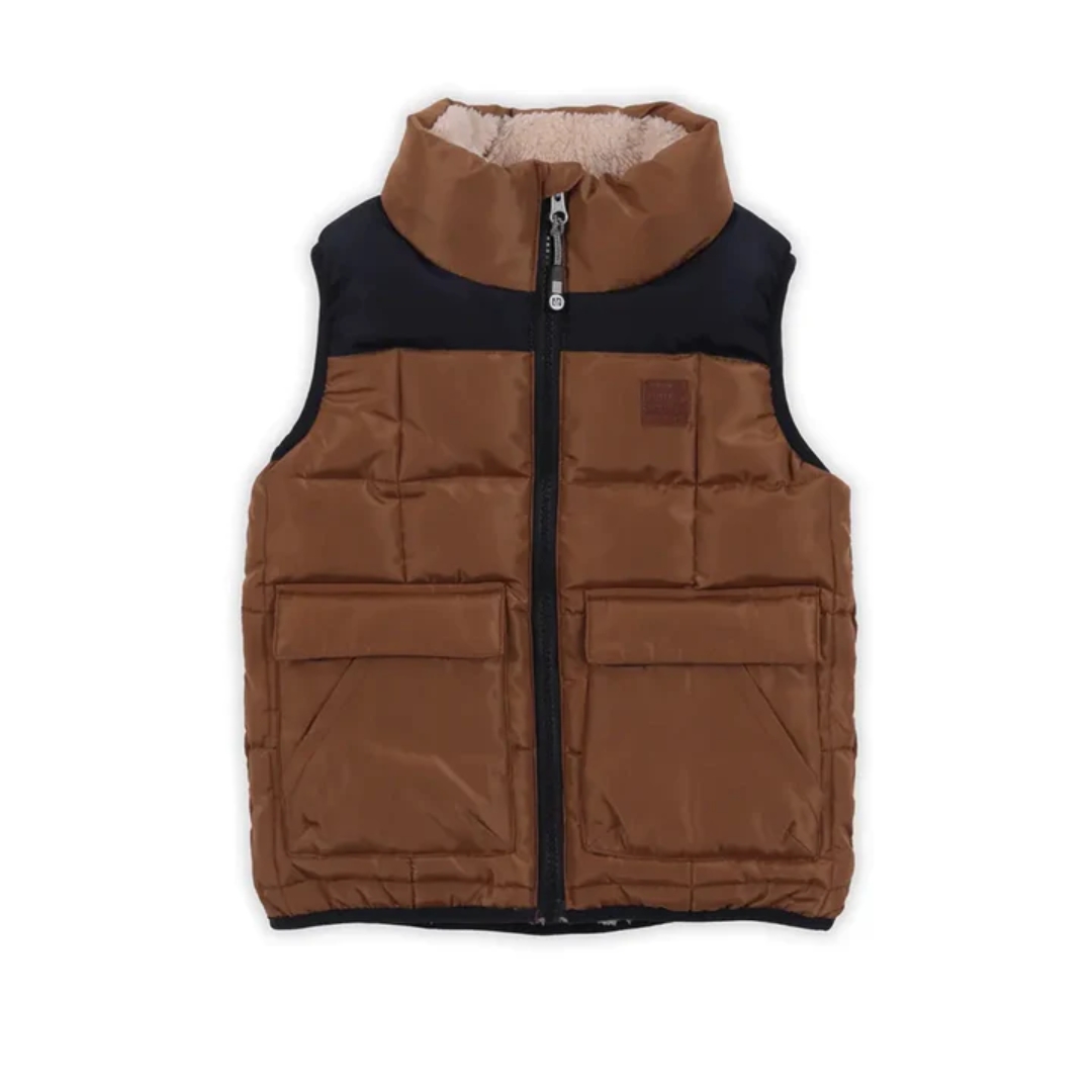 VESTE MATELASSÉE SANS MANCHES NANÖ POUR ENFANT couleur taupe vu de la veste matelassée brune et noire de face
