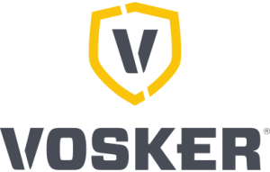Logo VOSKER comportant un contour de bouclier jaune stylisé avec une lettre noire « V » à l'intérieur, positionnée au-dessus du mot majuscule en gras « VOSKER » en lettres noires.
