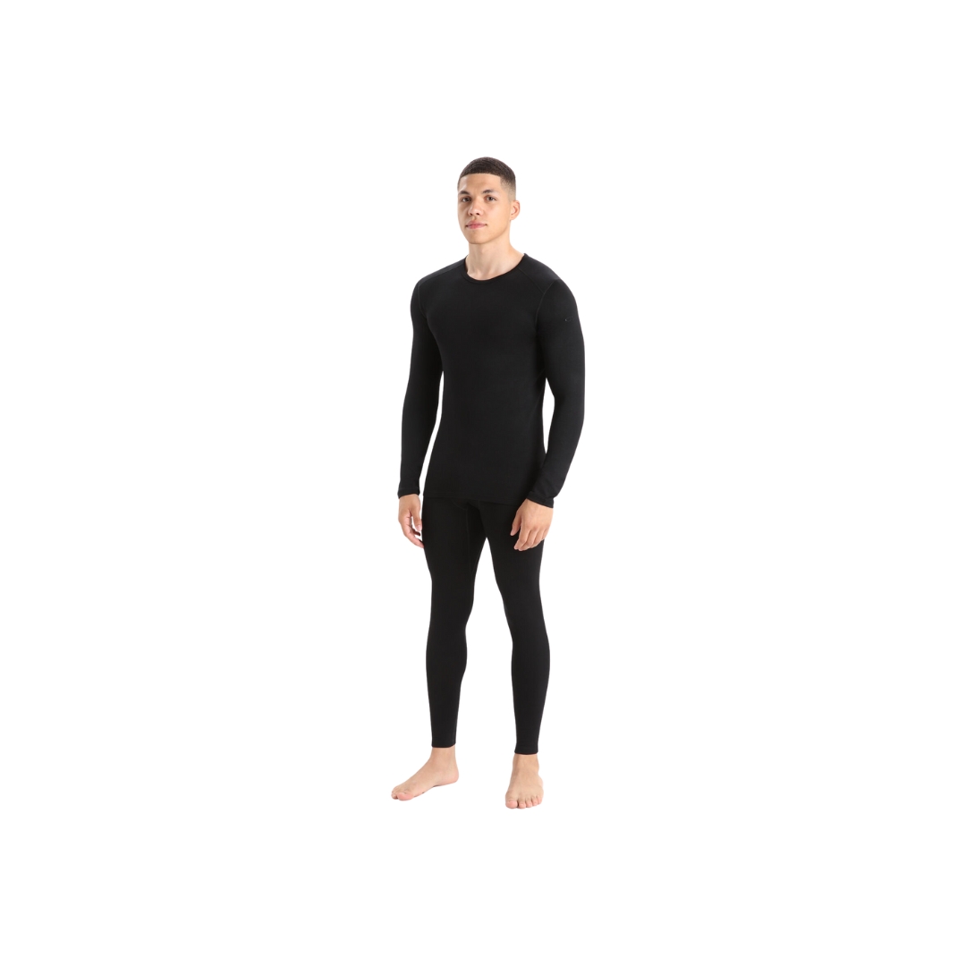 LEGGING COUCHE DE BASE ICEBREAKER AVEC BRAGUETTE 260 TECH EN MÉRINO de couleur noir porter par un homme vu de face de la tête au pied