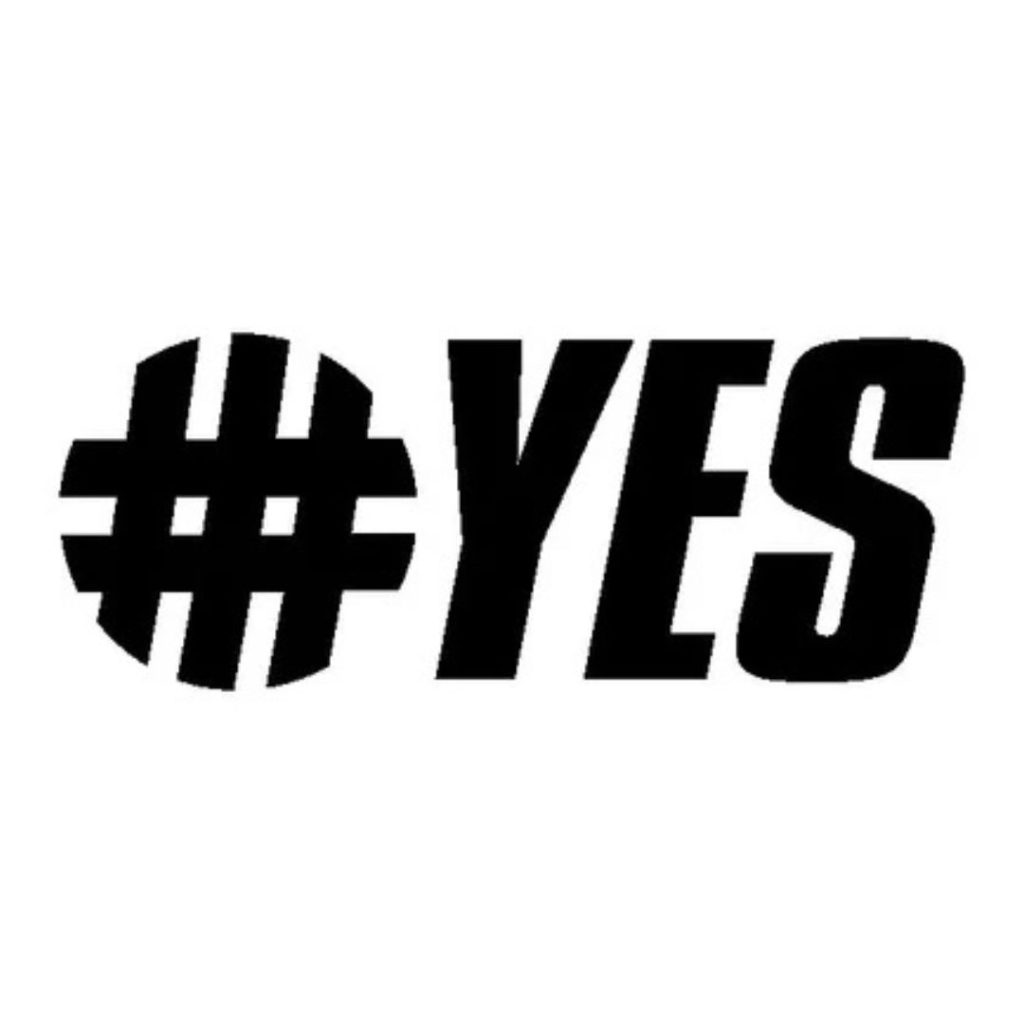 Le texte noir en gras sur fond blanc indique "#YES", avec le symbole du hashtag formé par des lignes épaisses et les lettres "YES" en majuscules, en italique et à faible espacement.